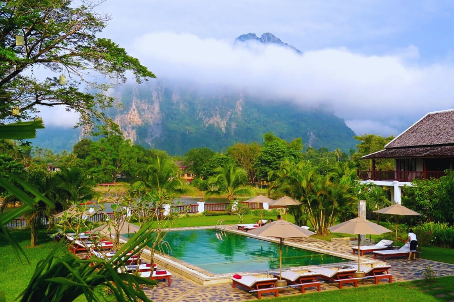 Luxury resort pool with mountain view in Vang Vieng Laos – Auasia Travel